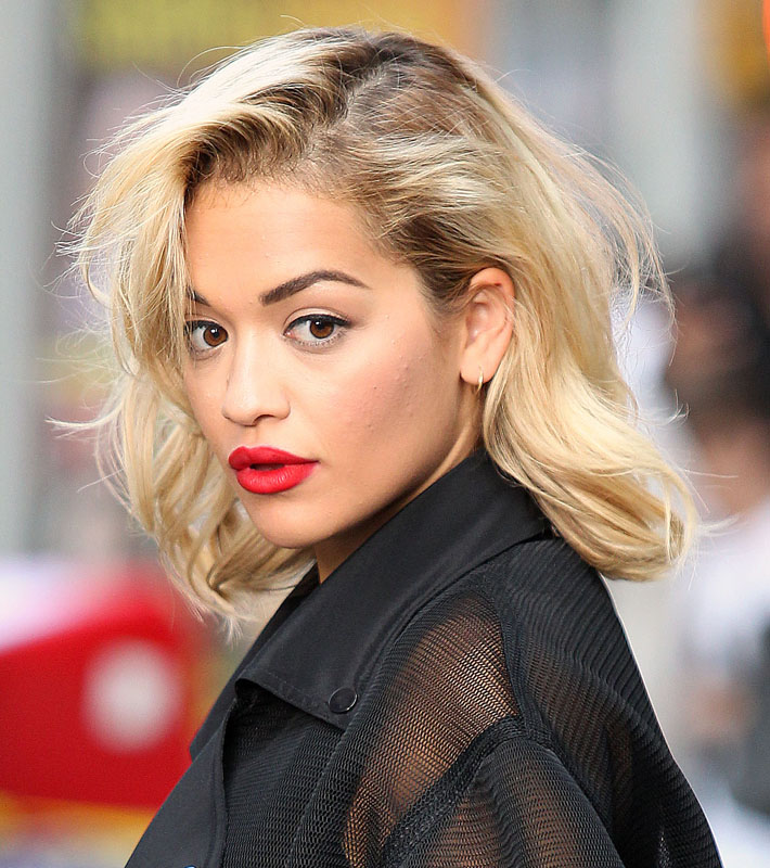 Rita Ora seen posing for a photoshoot for DKNY in Times Square, New York City